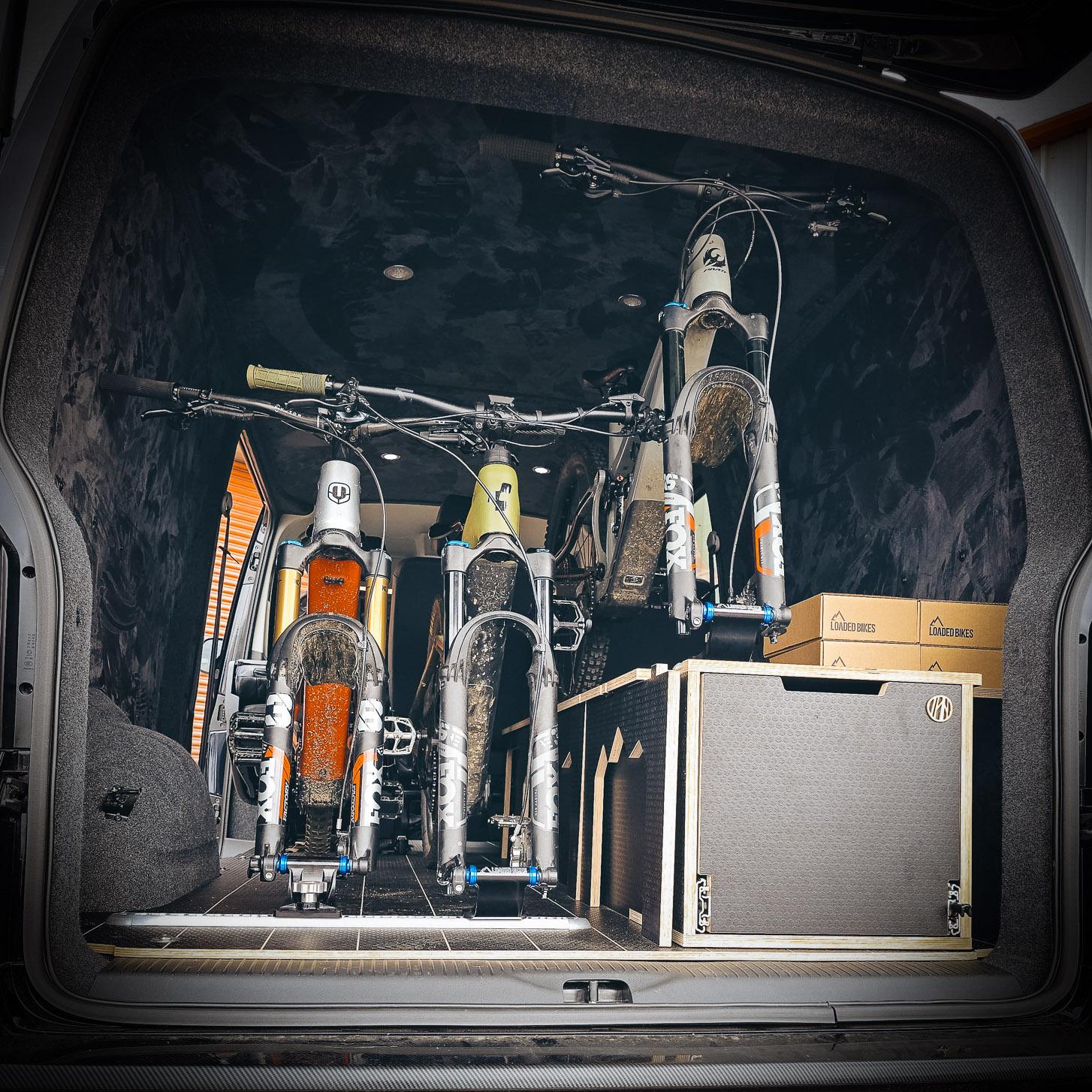 Bicycle fork mount - loaded bikes Three mountain bikes on fork mounts in a van
